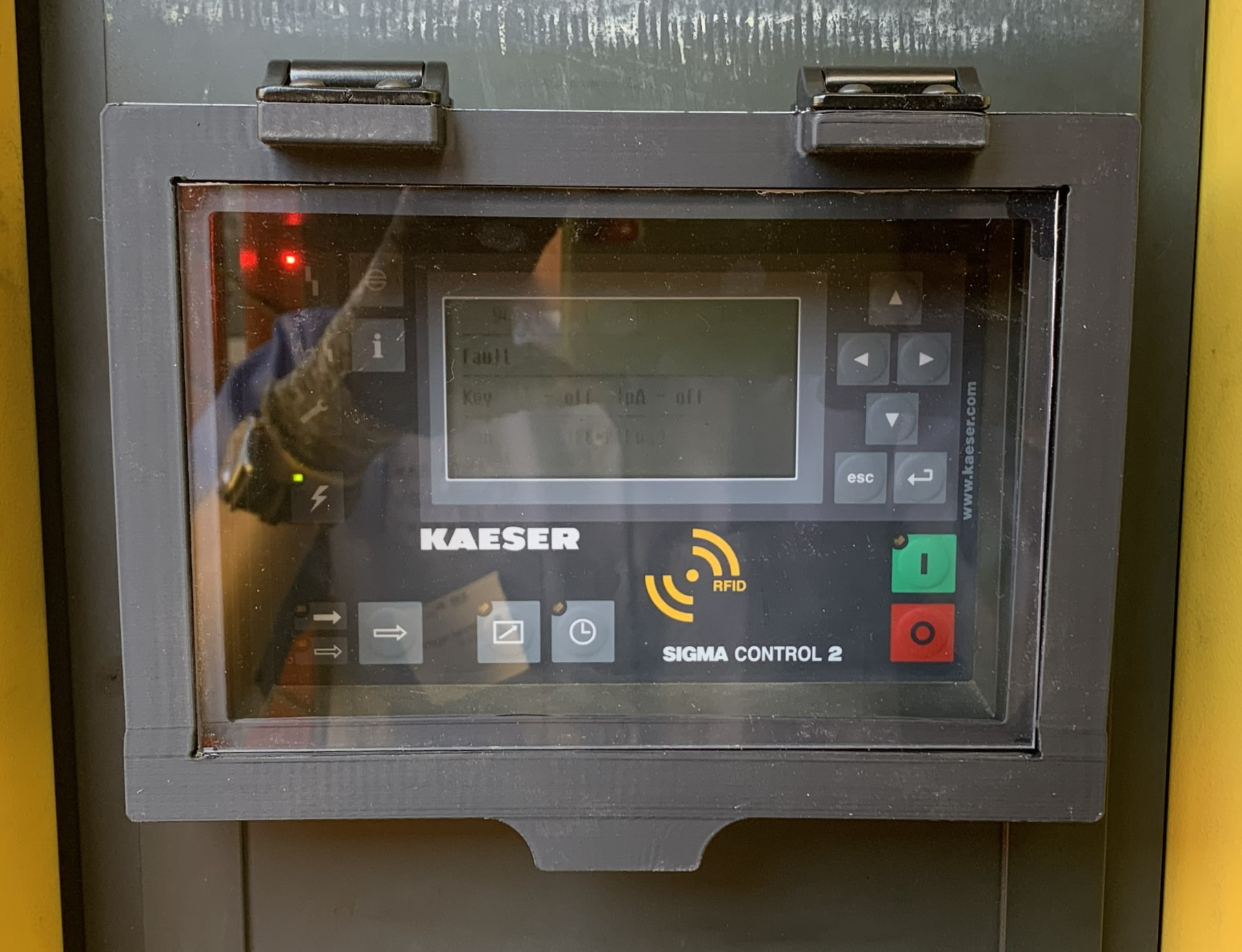 Sigma Control 2 behind scratched, hazed plastic showing a fault screen